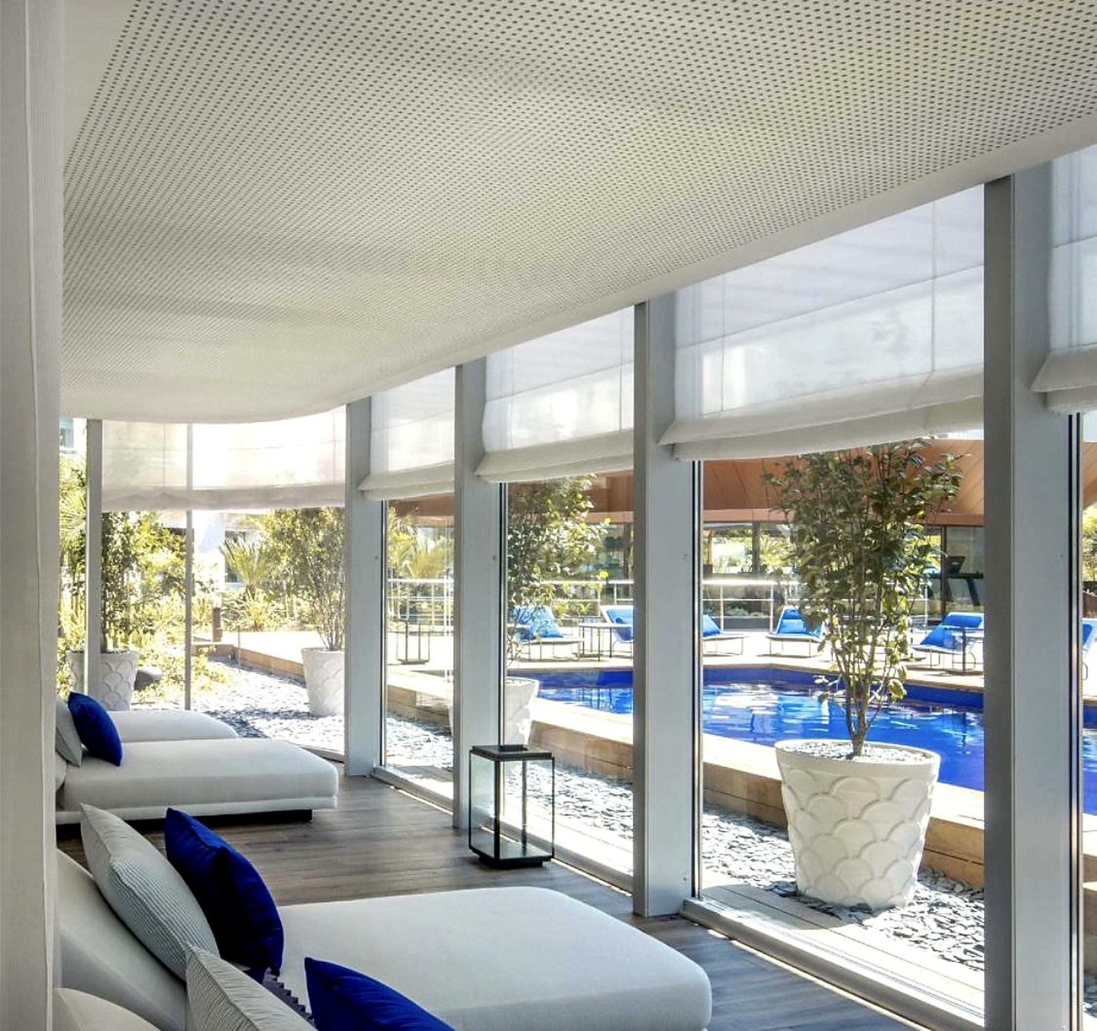 Poolside relaxation lounge with white day beds