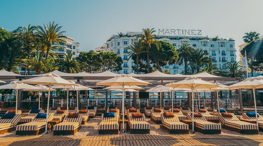 The iconic palace hotel of Cannes on La Croisette at golden dusk